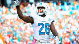 MIAMI GARDENS, FL - OCTOBER 25:  Lamar Miller #26 of the Miami Dolphins celebrates his touchdown in the second quarter against the Houston Texans at Sun Life Stadium on October 25, 2015 in Miami Gardens, Florida.  (Photo by Chris Trotman/Getty Images)