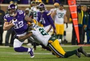 Nov 22, 2015; Minneapolis, MN, USA; Minnesota Vikings tight end Kyle Rudolph (82) breaks a tackle from Green Bay Packers safety Ha Ha Clinton-Dix (21) during the third quarter at TCF Bank Stadium. The Packers defeated the Vikings 30-15. Mandatory Credit: Brace Hemmelgarn-USA TODAY Sports