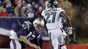 Philadelphia Eagles safety Malcolm Jenkins runs past a tackle attempt by New England Patriots quarterback Tom Brady (12) with a 100-yard interception return for a touchdown during the second half of an NFL football game, Sunday, Dec. 6, 2015, in Foxborough, Mass. (AP Photo/Steven Senne)