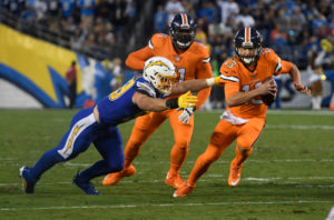 SAN DIEGO, CA - OCTOBER 13: Denver Broncos quarterback Trevor Siemian (13) gets caught from behind by San Diego Chargers defensive end Joey Bosa (99) during the second quarter October 13, 2016 at Paul Brown Stadium. (Photo By John Leyba/The Denver Post)