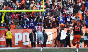 Nov 27, 2016; Cleveland, OH, USA; New York Giants defensive end Jason Pierre-Paul (90) returns an interception for a touchdown during the second half against the Cleveland Browns at FirstEnergy Stadium. Mandatory Credit: Ken Blaze-USA TODAY Sports